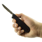 Civilware's Interchangeable Blade Knife in Black. Ultralight titanium skinning knife with removable and replaceable surgical blades for easy, precision skinning of big and small game animals, alike.