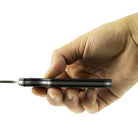 Civilware's Interchangeable Blade Knife in Black. Ultralight titanium skinning knife with removable and replaceable surgical blades for easy, precision skinning of big and small game animals, alike.